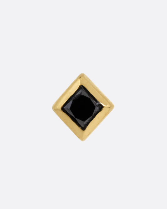 A yellow gold stud earring with a princess cut black diamond, shown from the front.