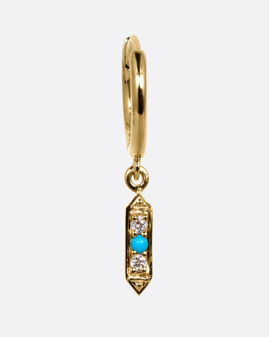 A yellow gold hoop earring with a diamond and turquoise dangle, shown from the front.