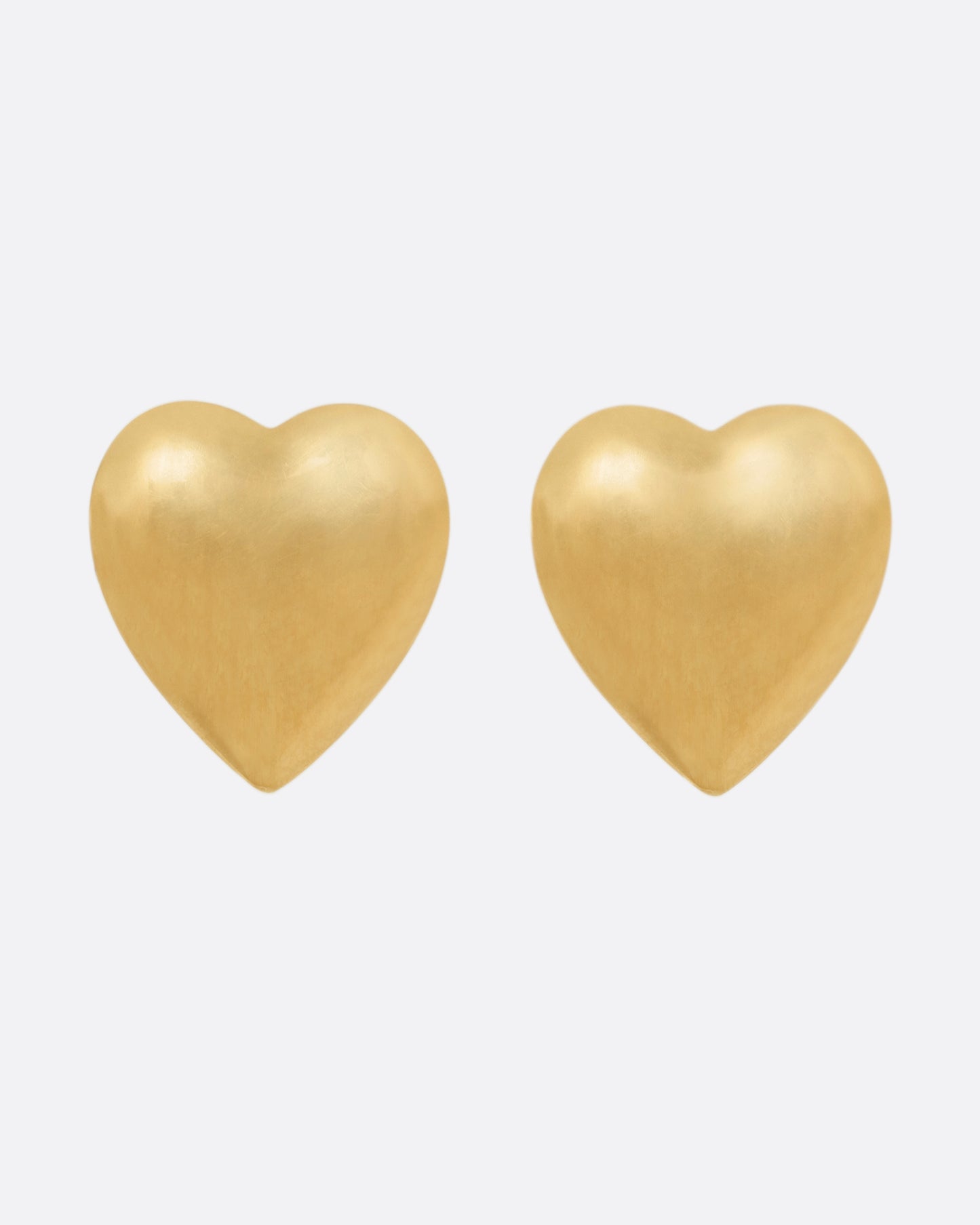 A pair of yellow gold heart-shaped stud earrings, shown from the front.