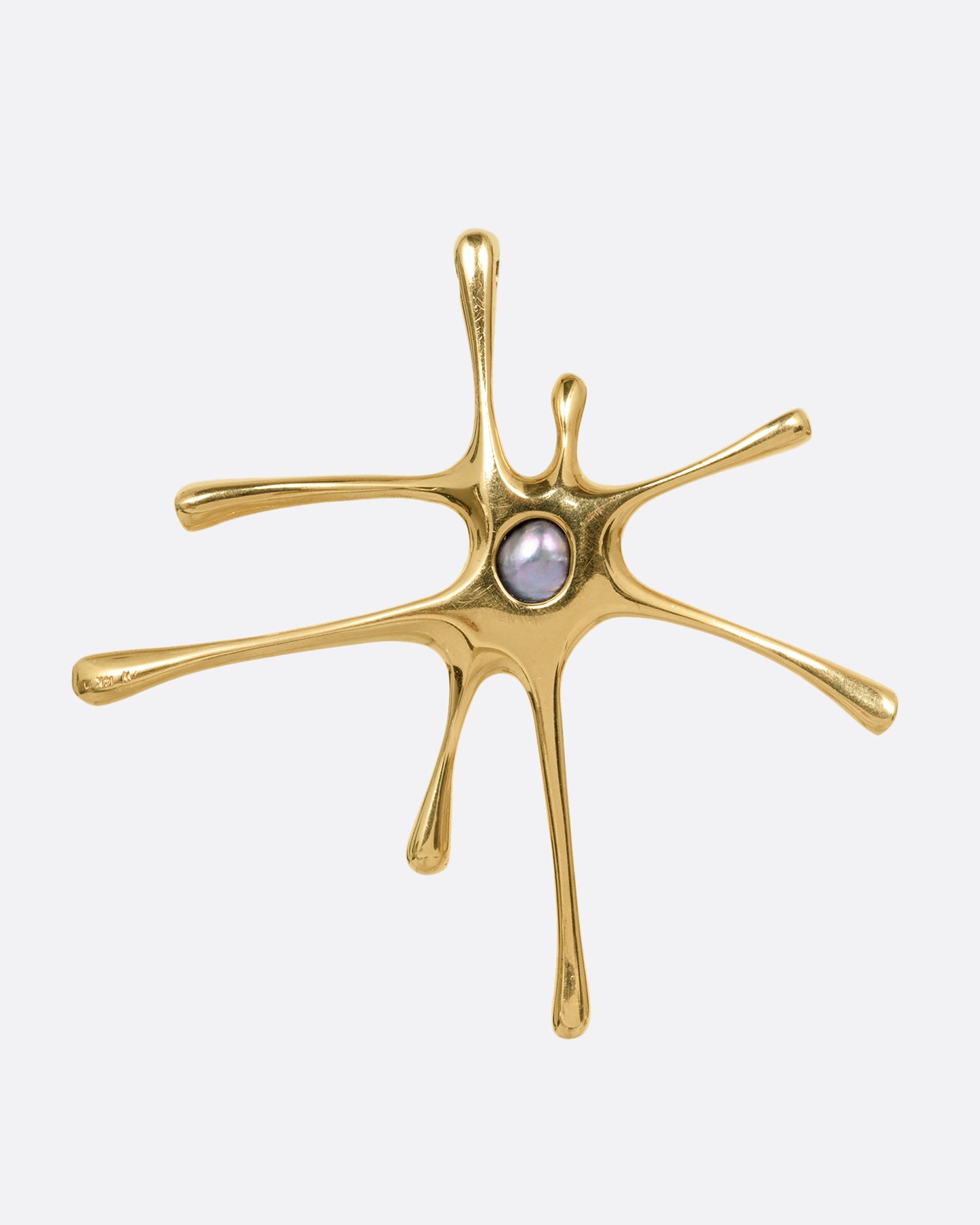 A yellow gold amoeba shaped pendant with a central pearl, shown from the back.