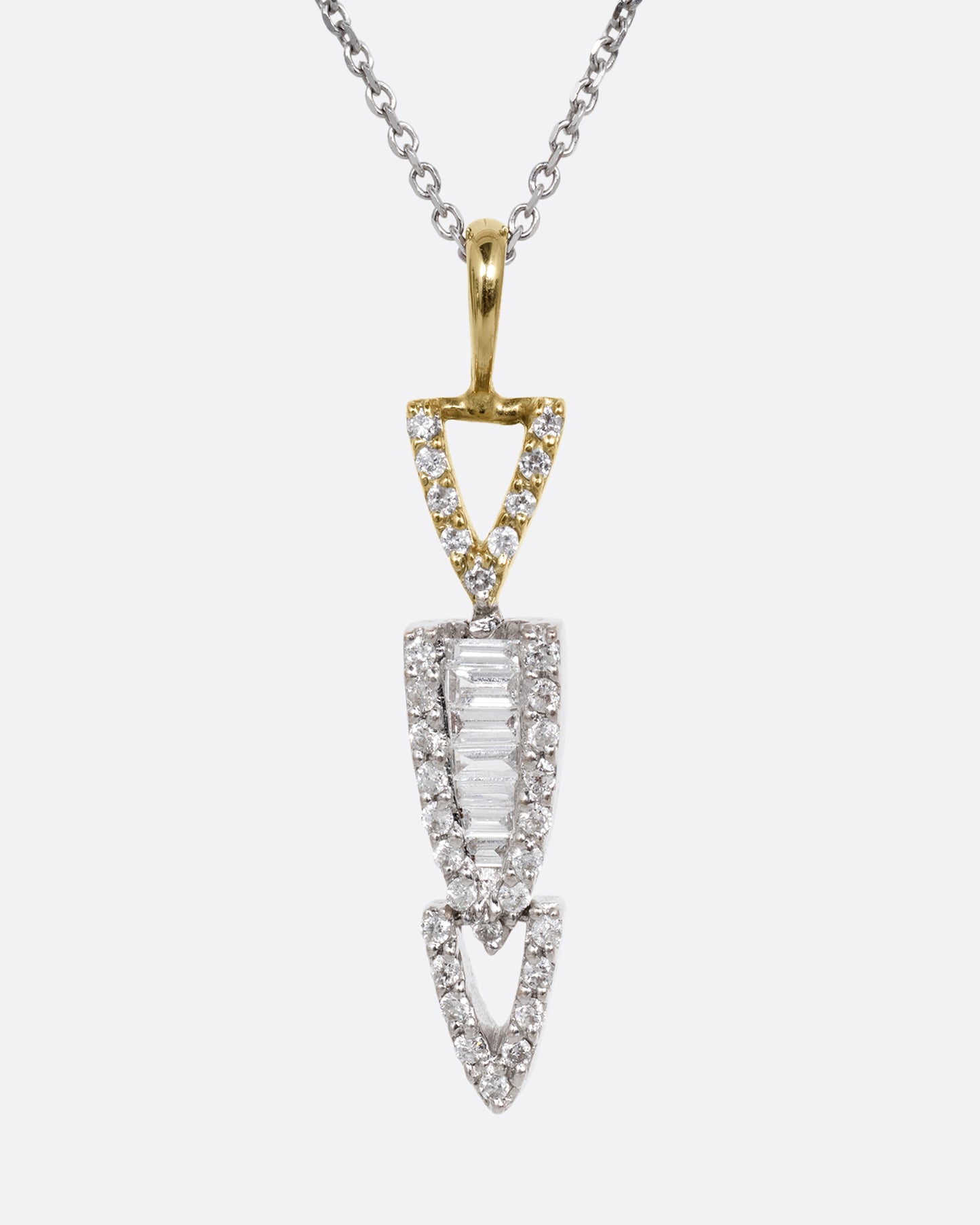 A white gold cable chain necklace with a diamond studded stack of arrows. Shown from the front.