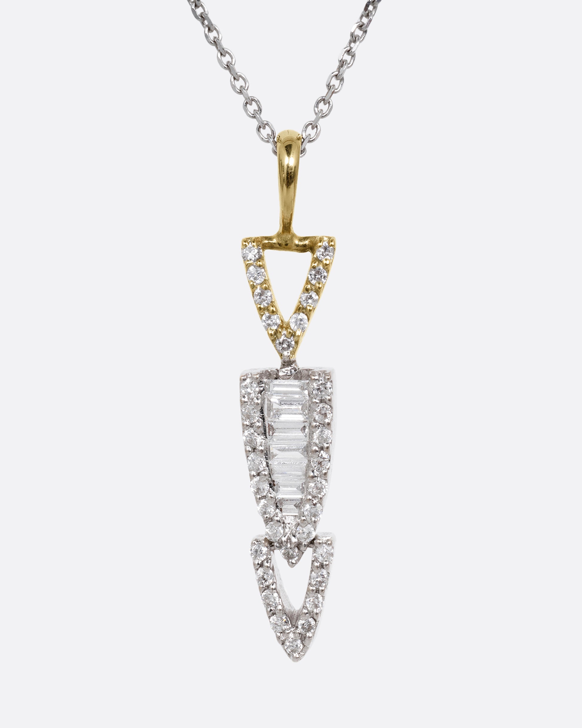 A white gold cable chain necklace with a diamond studded stack of arrows. Shown from the front.