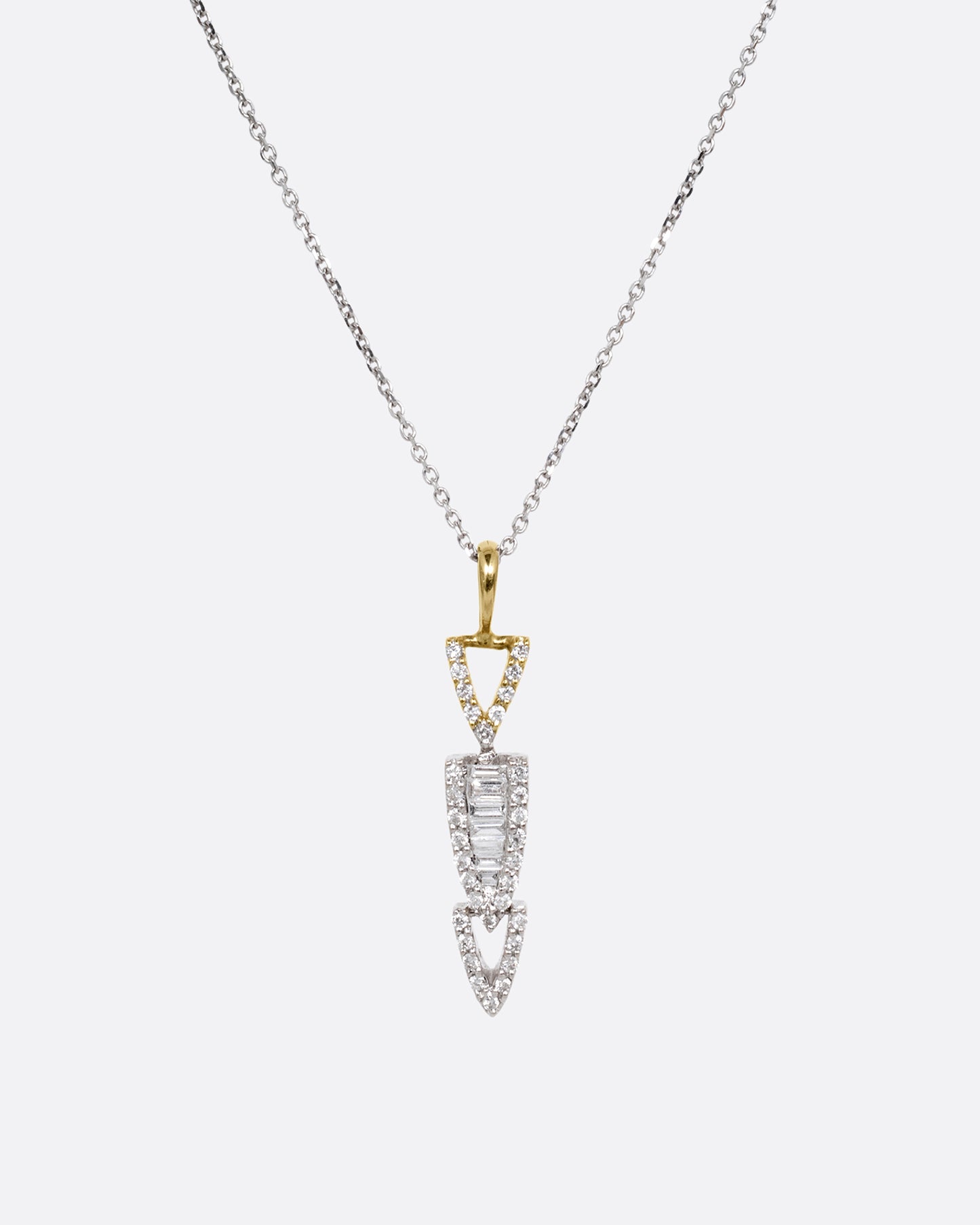 A white gold cable chain necklace with a diamond studded stack of arrows. Shown from the front.