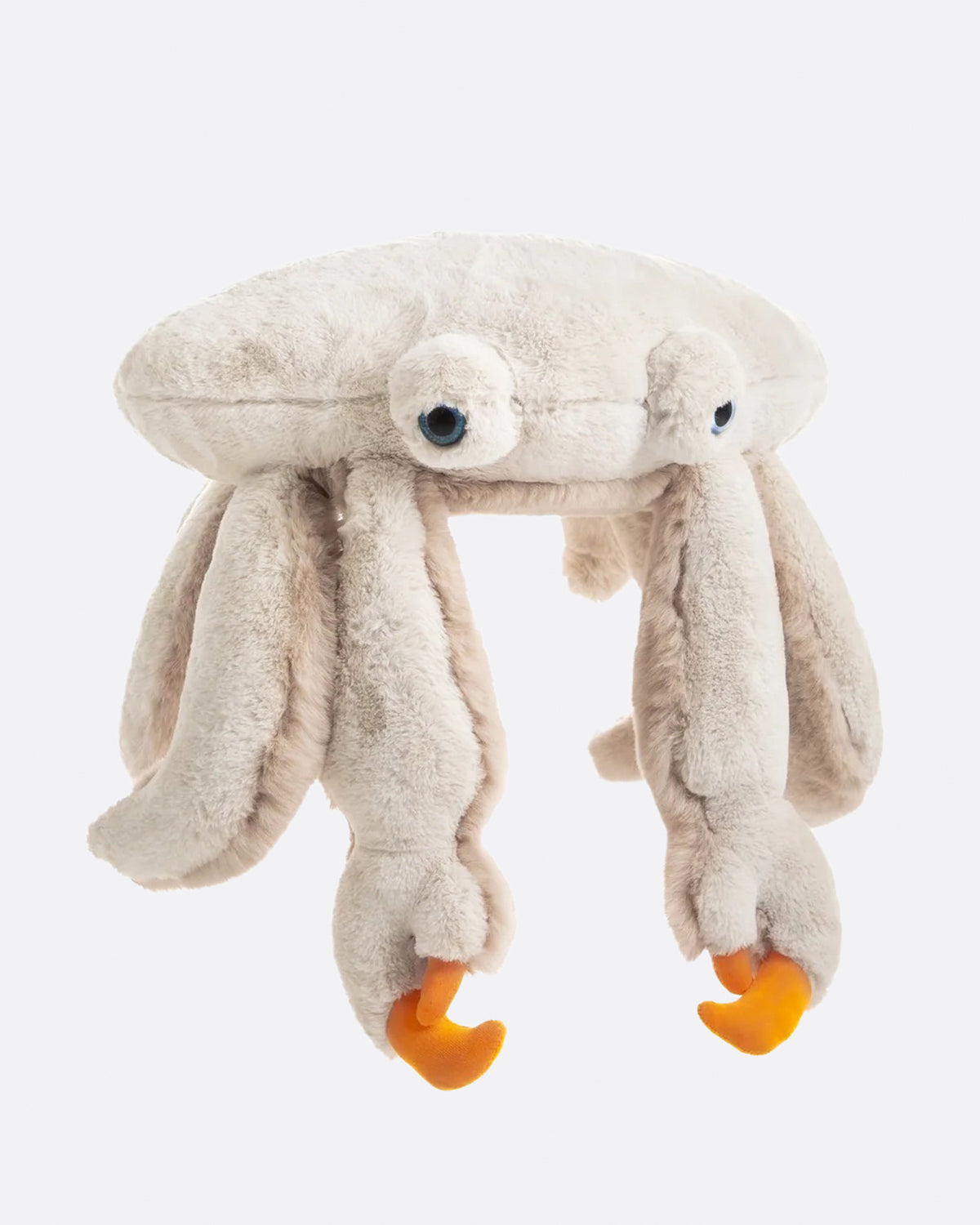 Large furry cream stuffed crab with long legs and orange claws, shown from the front.