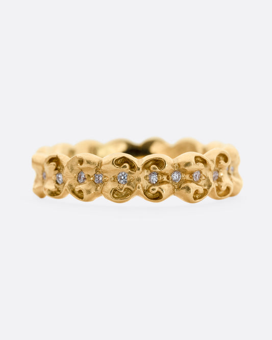 A bubble floral infinity band with round white diamonds all the way around. 