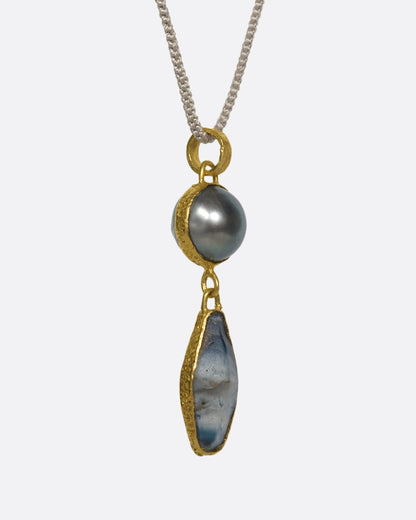 Yellow gold Tahitian pearl and sapphire pendant necklace, angled view of the two drops