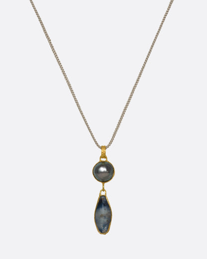Yellow gold Tahitian pearl and sapphire pendant necklace, front view of the pendant on its cord