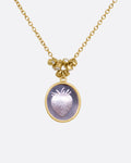 A yellow gold pendant necklace with a amethyst with a hand carved strawberry and a cluster of diamond charms, shown from the front.
