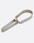 Stainless steel ice tongs with an arched handle, shown on their side.