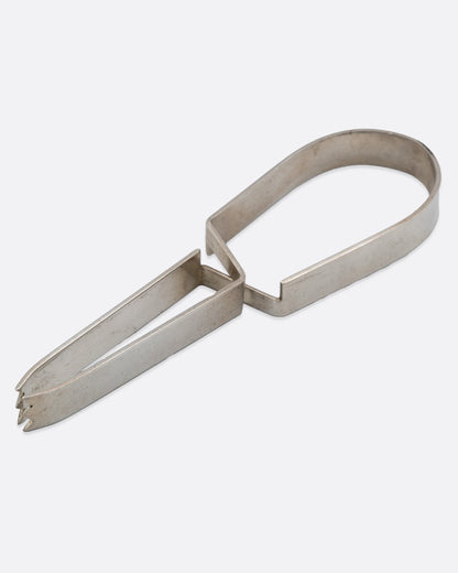 Vintage ice tongs in sterling silver, a flat looped spring band with toothed grips
