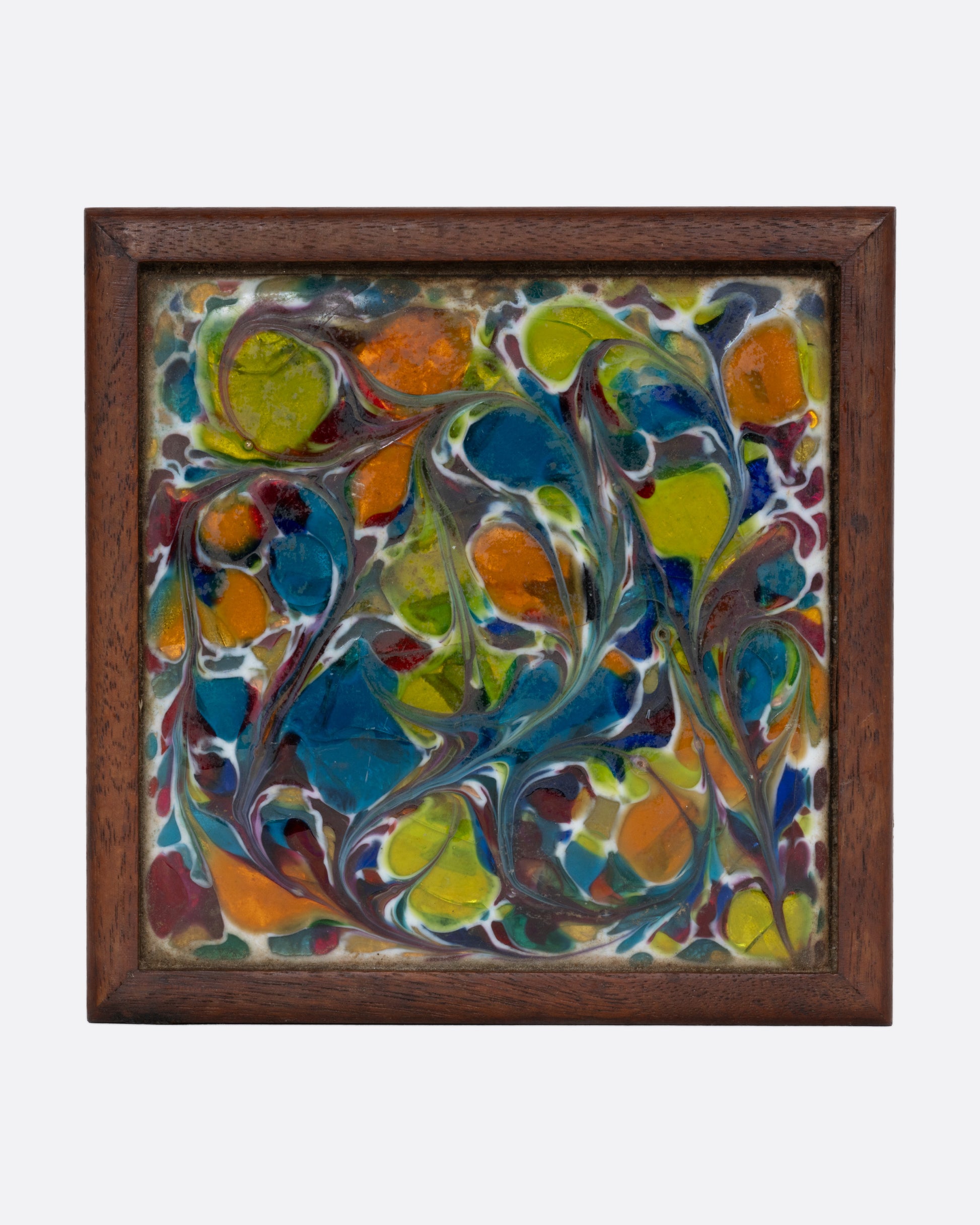 A wooden cigarette box with an abstract enamel design. Shown from the top.