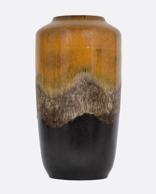 A tall ceramic vase with a ochre- to- brown gradient glaze, shown from the front.