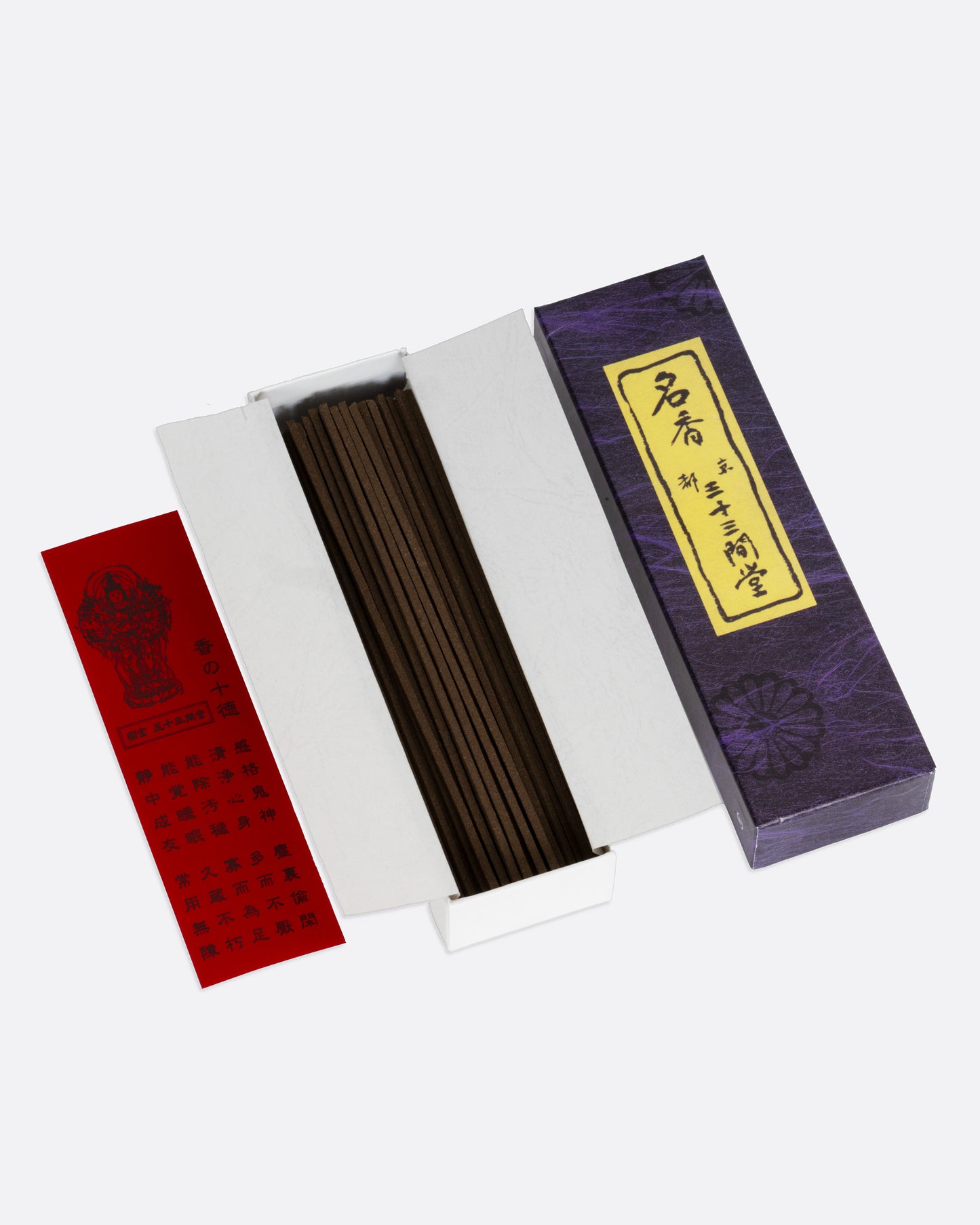A purple box of incense sticks in a box with a red insert, shown open from overhead.