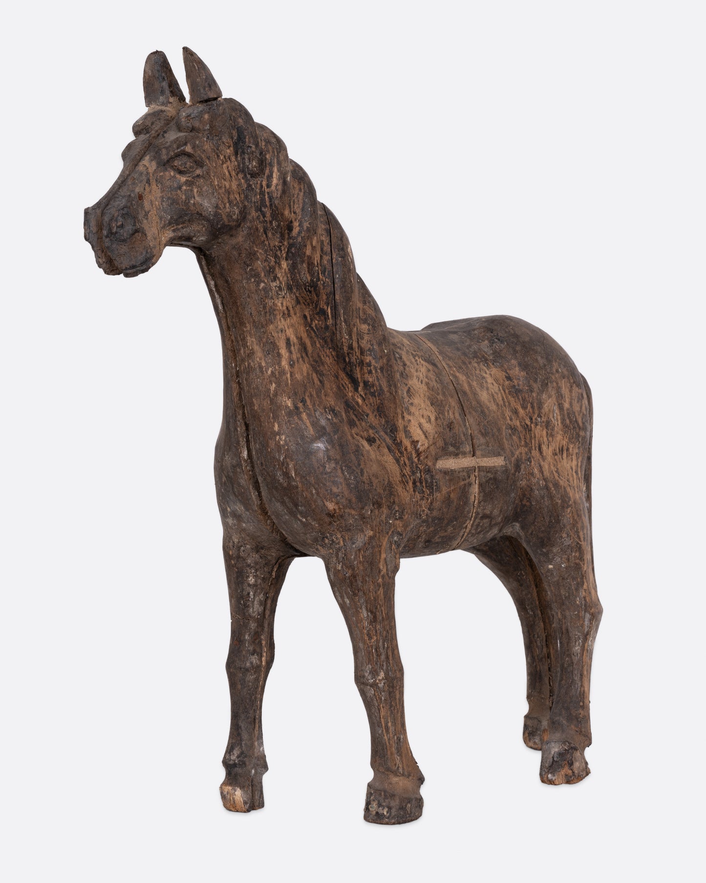 A wooden horse  takaan sculpture shown from the front.