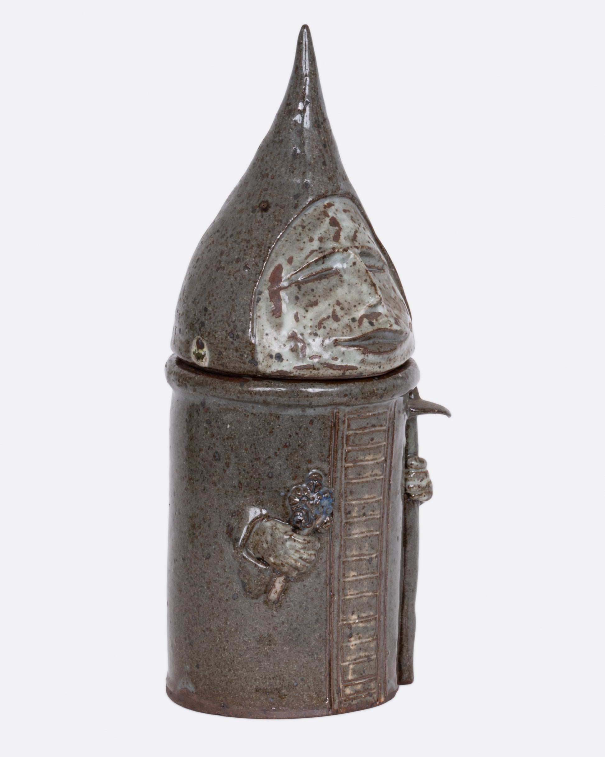 A this ceramic likeness of Saint Fiacre with a removable lid, shown from the side.