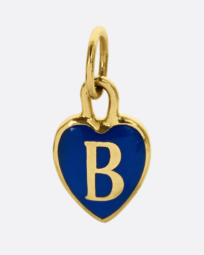 A yellow gold heart shaped charm with blue enamel and a letter B, shown from the front.