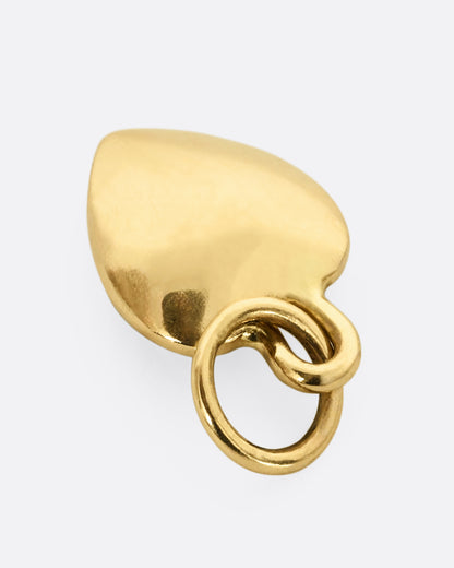 A yellow gold heart shaped pendant shown from the back.