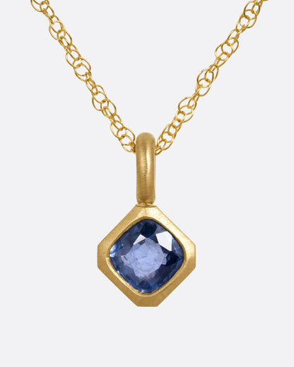 Elizabeth Street pendant necklace in 14k yellow gold, a cushion-cut blue sapphire in an offset satin-finish bezel with a heavy bail