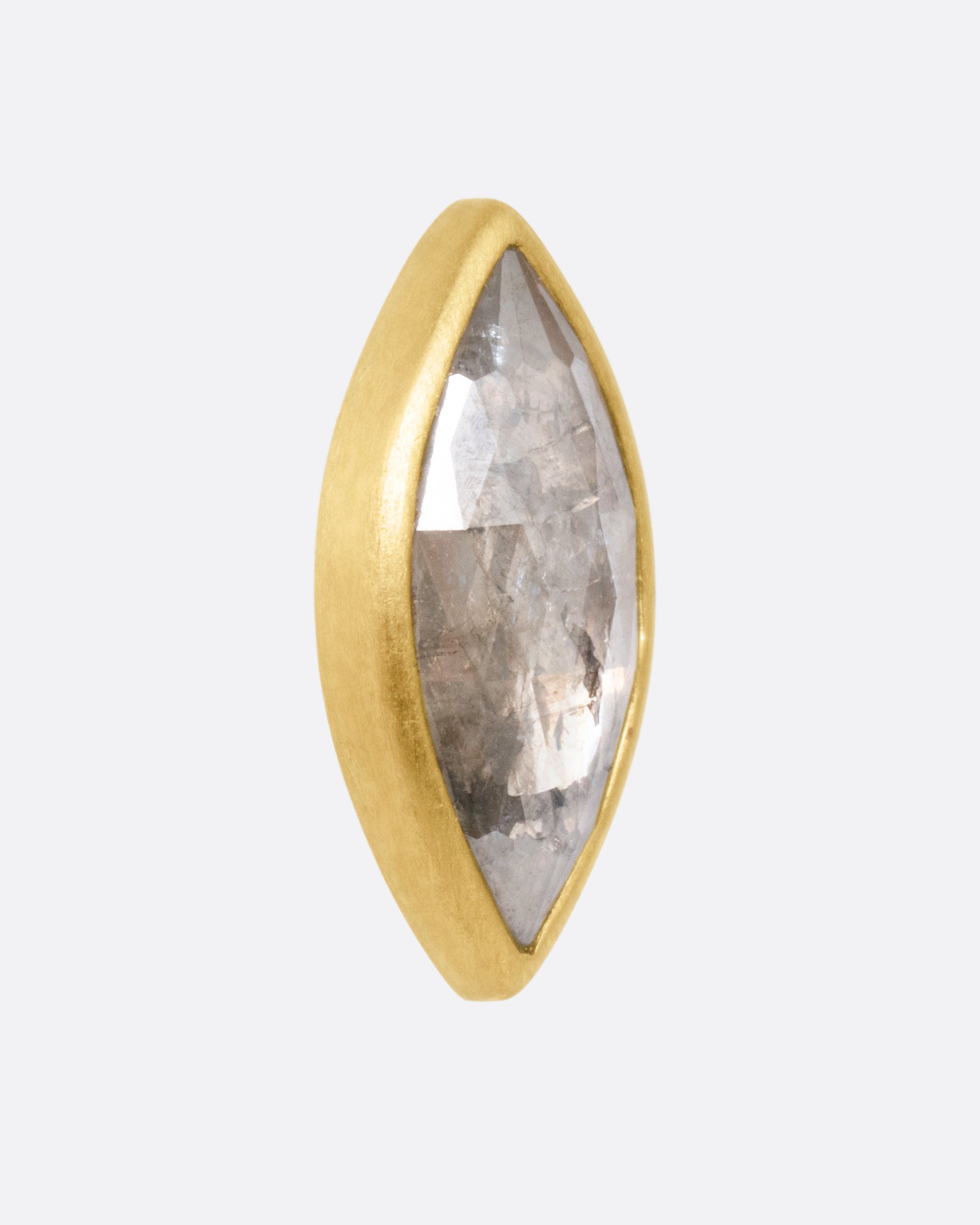 A yellow gold navette diamond earring, shown from the side.