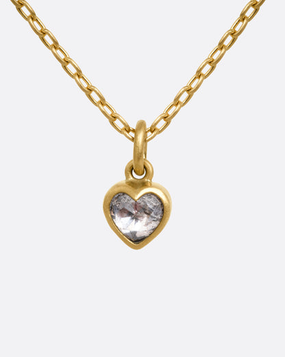 A yellow gold cable chain necklace with a dimensional diamond heart pendant, shown from the front.