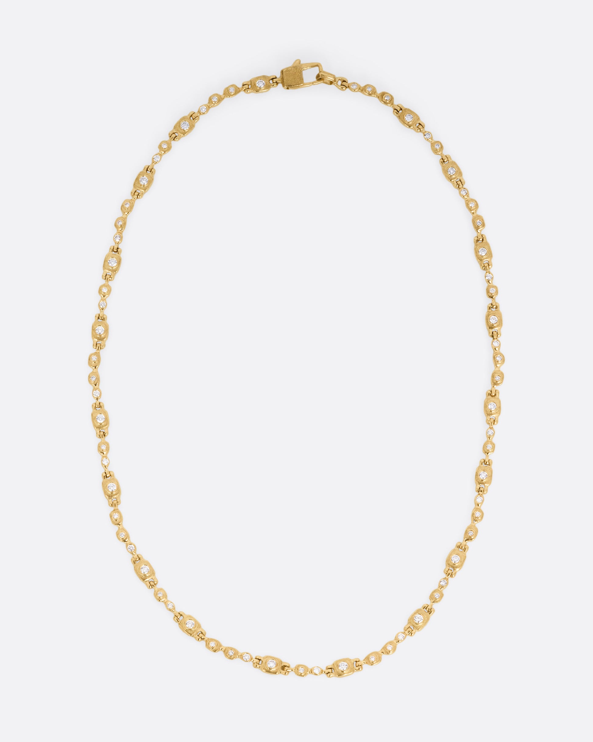 A yellow gold linked necklace with diamonds, shown from the front.