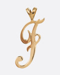 A yellow gold cursive 'F' pendant, shown from the front.