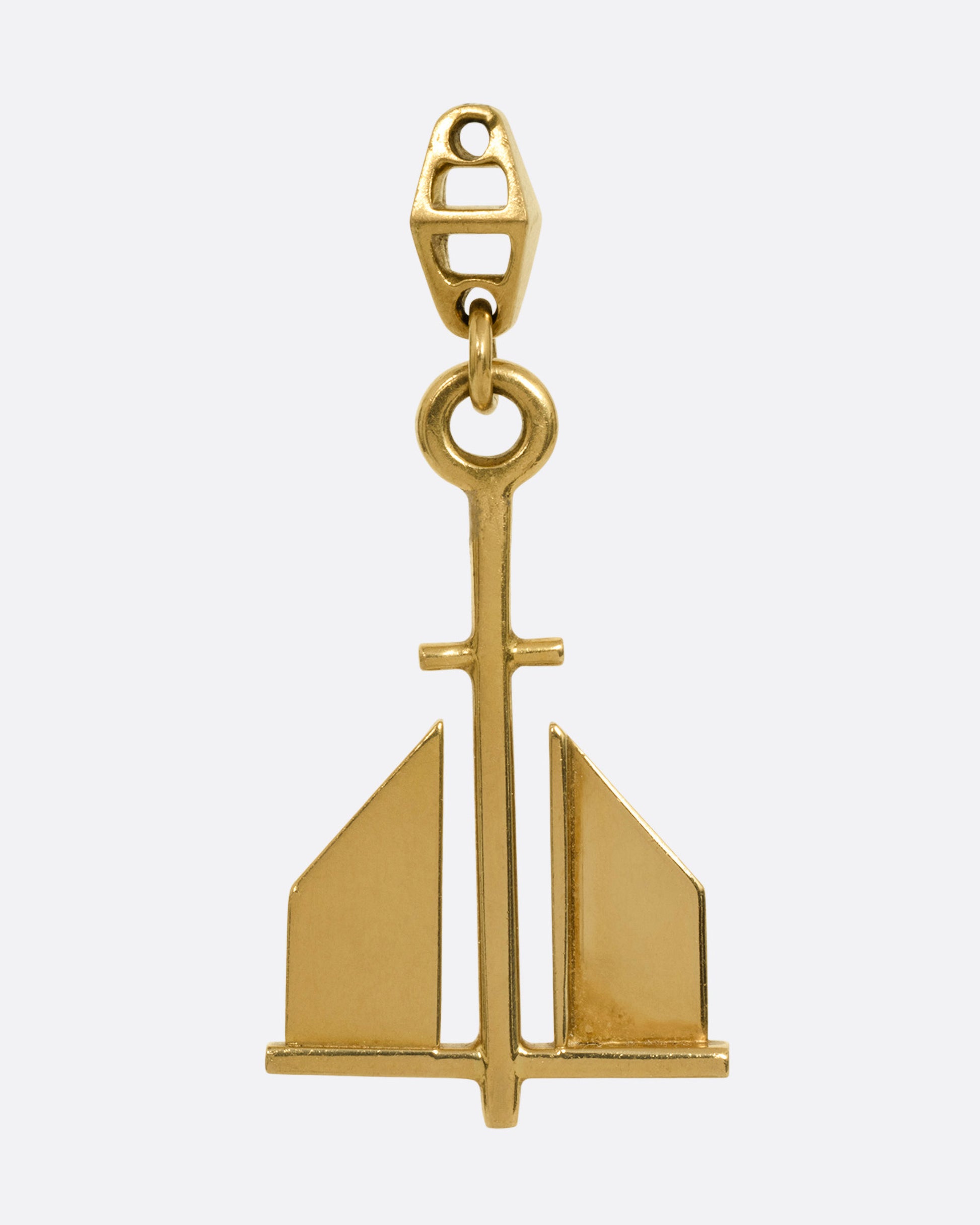 A yellow gold anchor pendant, shown from the front.