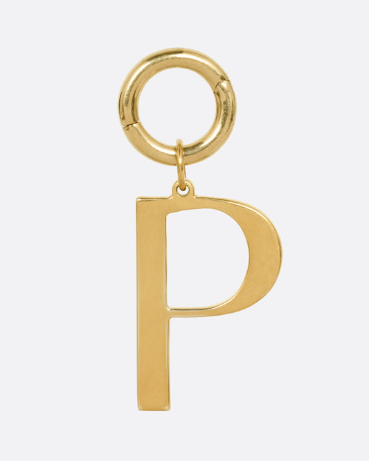 A yellow gold 'P' shaped pendant, shown from the front.