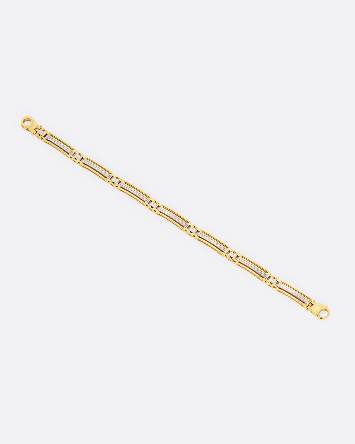 A yellow and white gold bracelet, shown from the front.