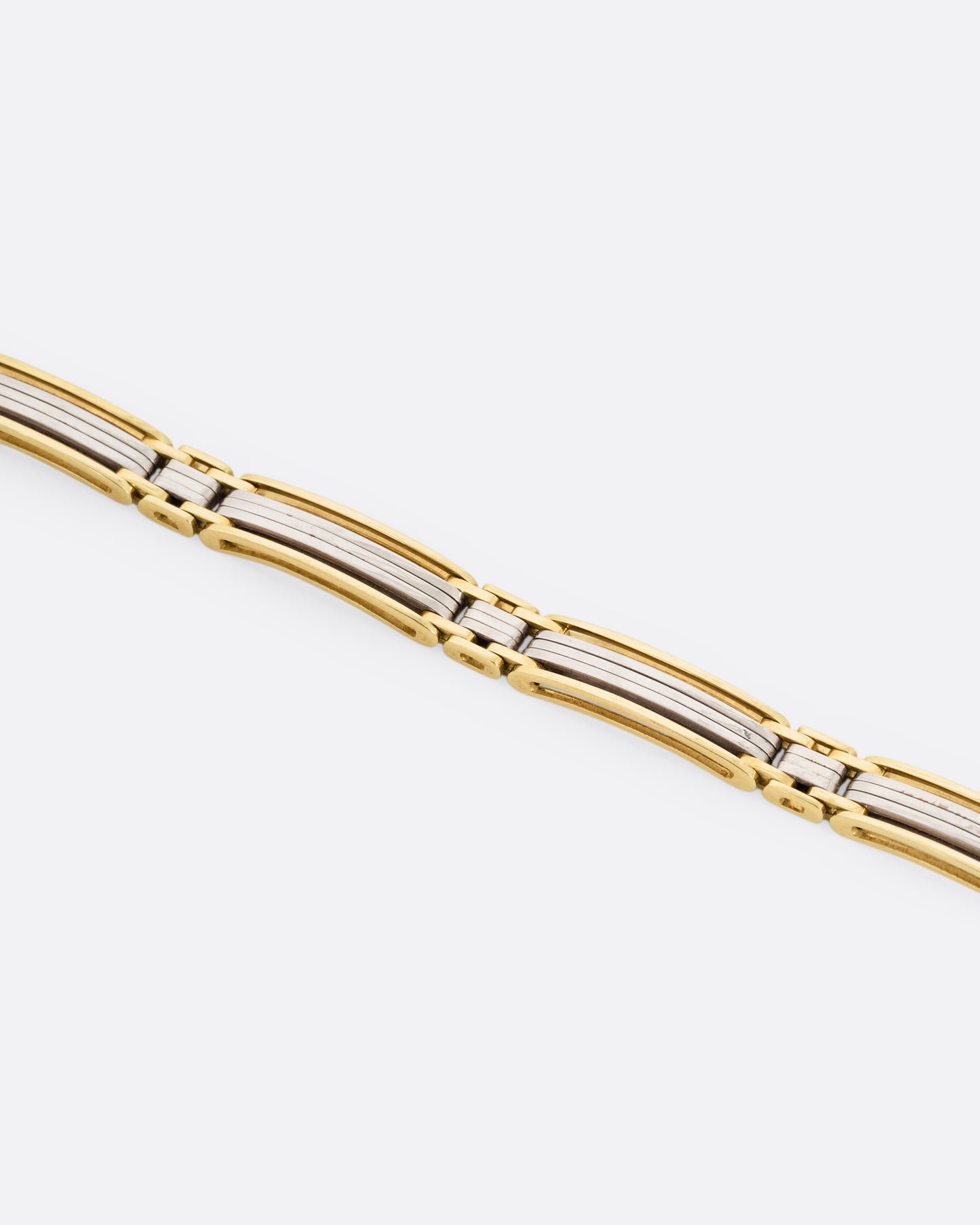 A yellow and white gold link bracelet, shown from the front.
