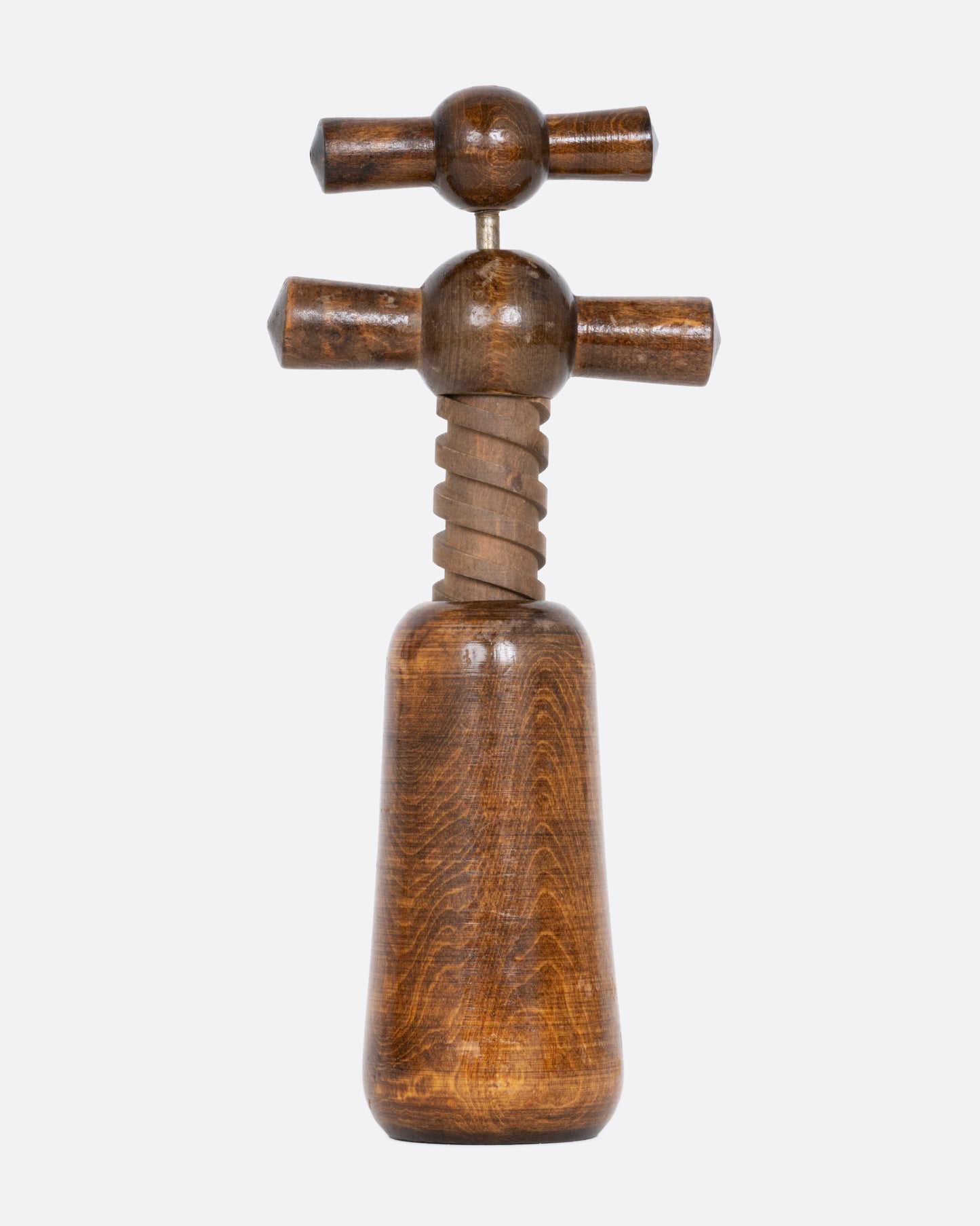 A wooden cork screw, shown from the front.