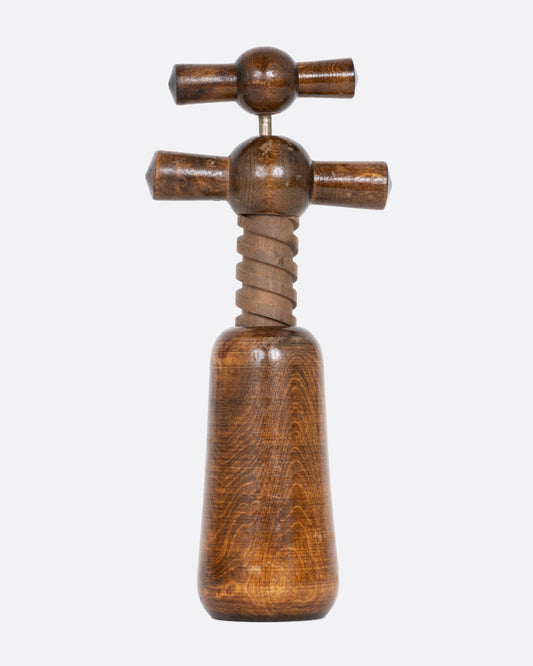 A wooden cork screw, shown from the front.