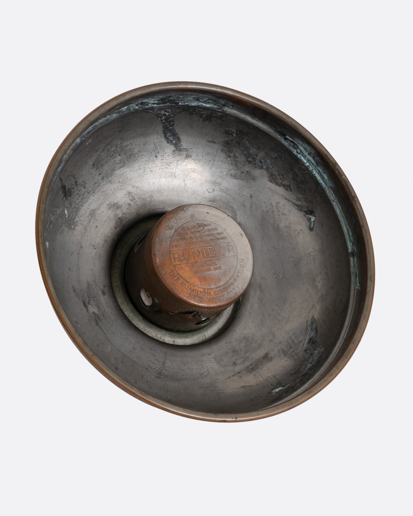 The inside of the domed lid to a brass humidor.