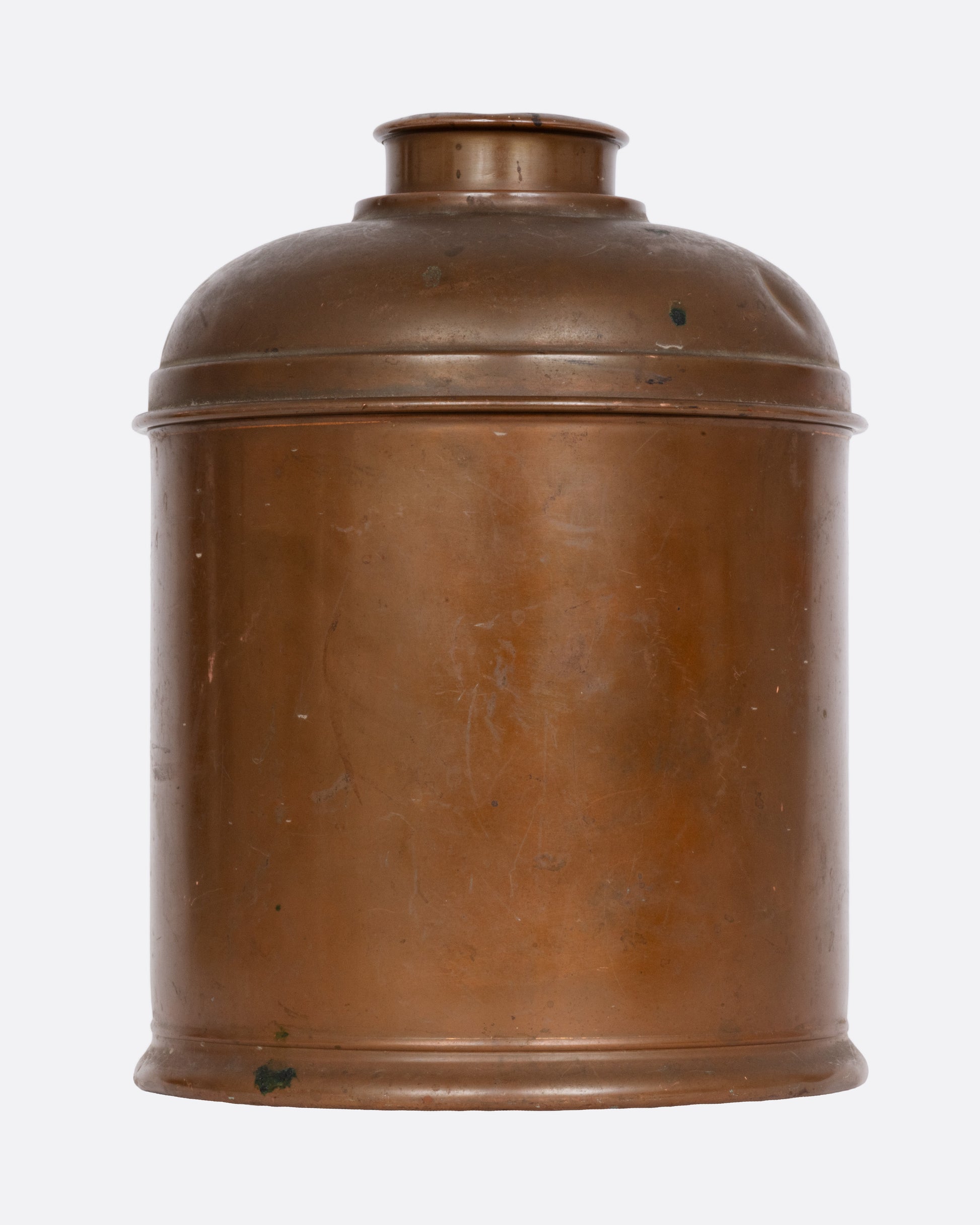 A brass humidor with a domed lid, shown from the front.
