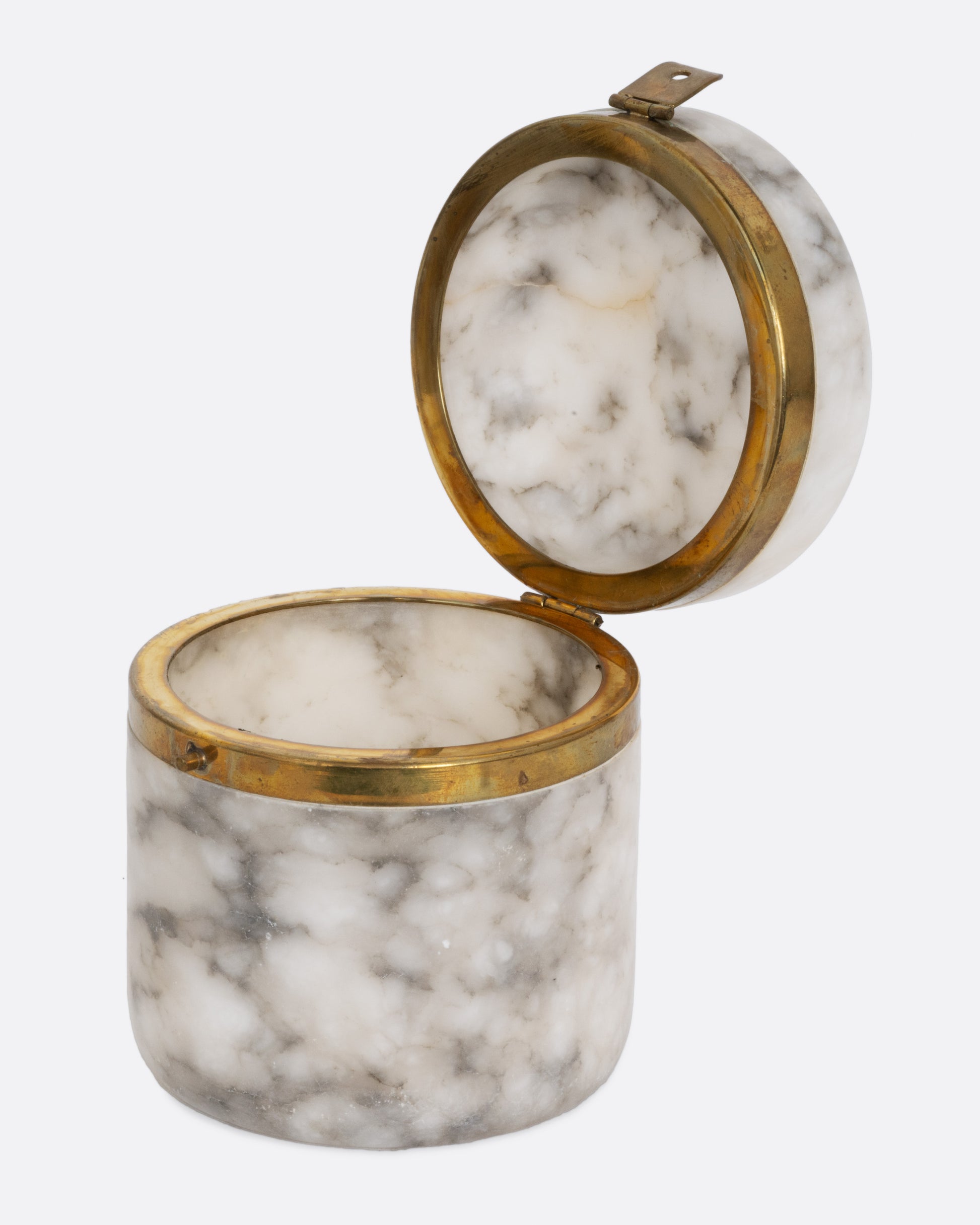 A lidded white alabaster box with gold trim and a clasp. Shown open from the side.