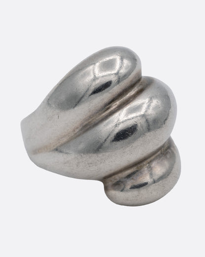 A silver ring with three domed tiers, shown from the side.