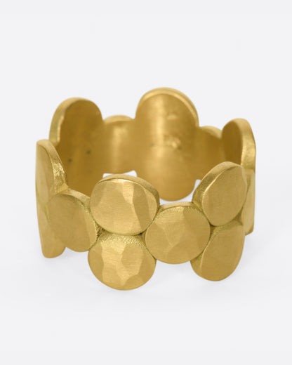 Matte yellow gold disc band, side view of the band showing the scalloped edges