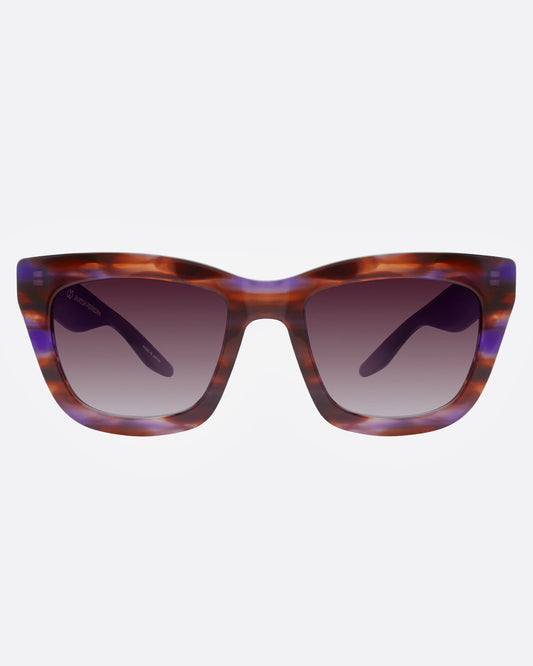 A pair of sunglasses with tortoiseshell frames with flecks of purple and gradient lenses, shown from the front.