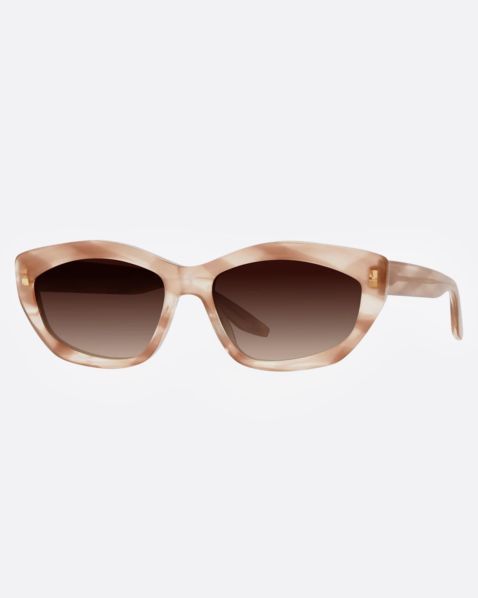 A pair of sunglasses with a cat-eye silhouette and dusty rose marbled frames and brown gradient lenses, shown from the side.