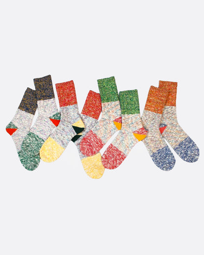 Four pairs of multicolored marl socks with dual-toned heels, shown from the side.