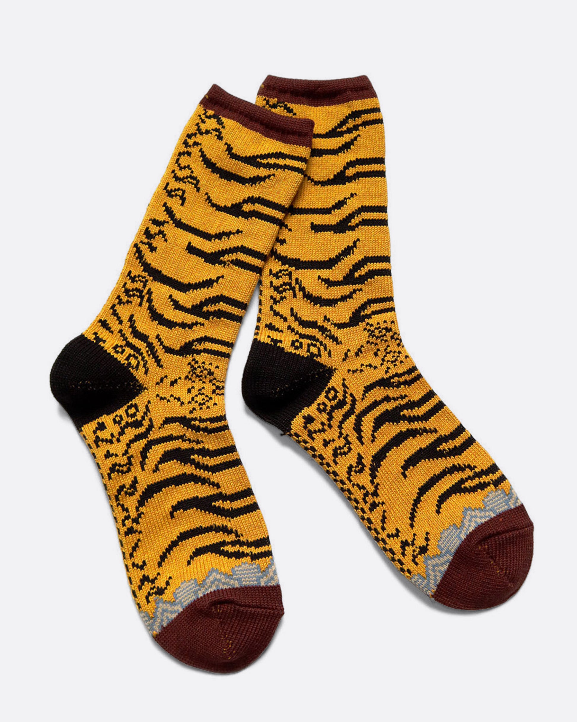 A pair of yellow, maroon, and black tiger print socks. Shown from the side.