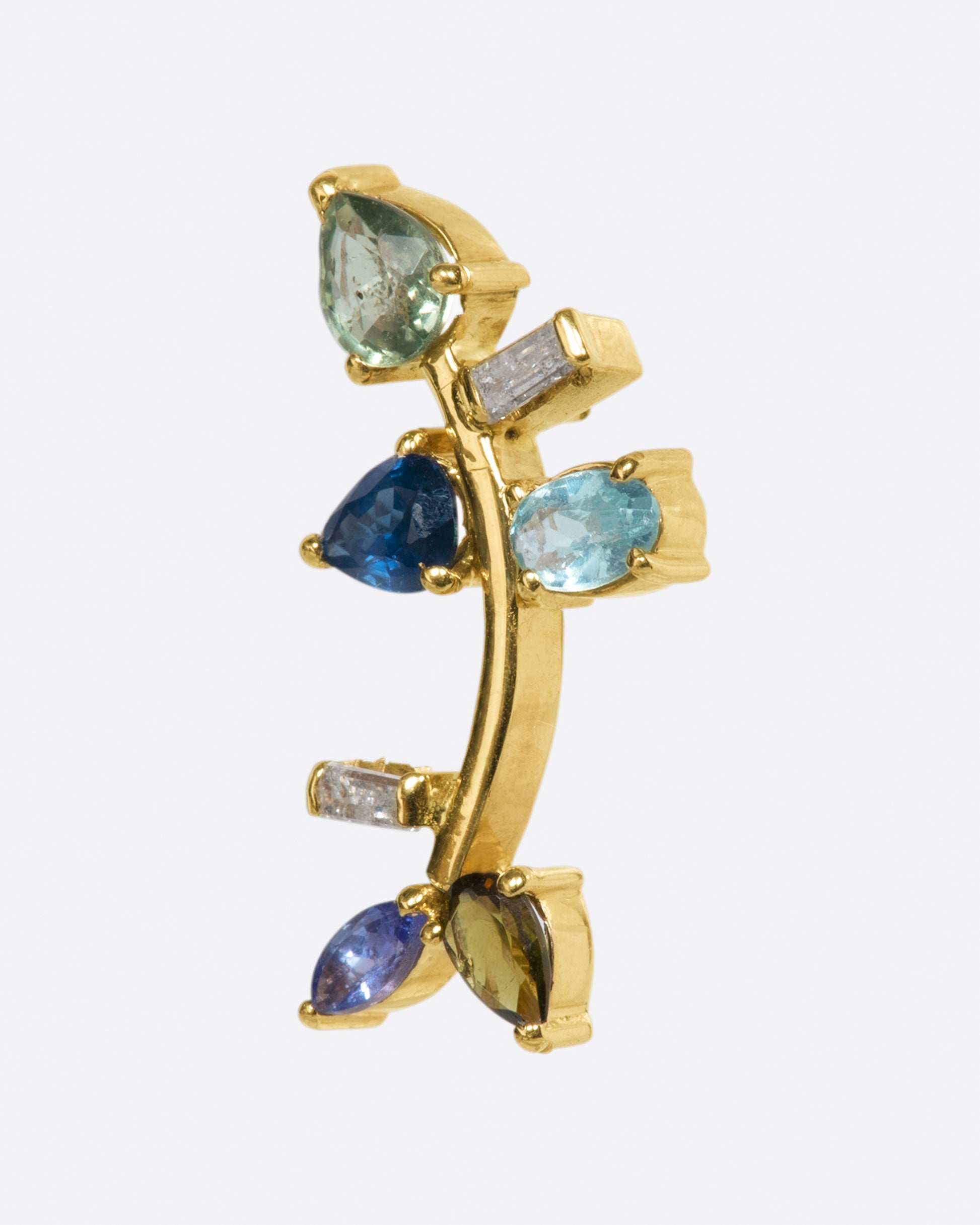 This elegant 14k gold stud, dotted with blue and green gemstones, reminds us of an olive branch