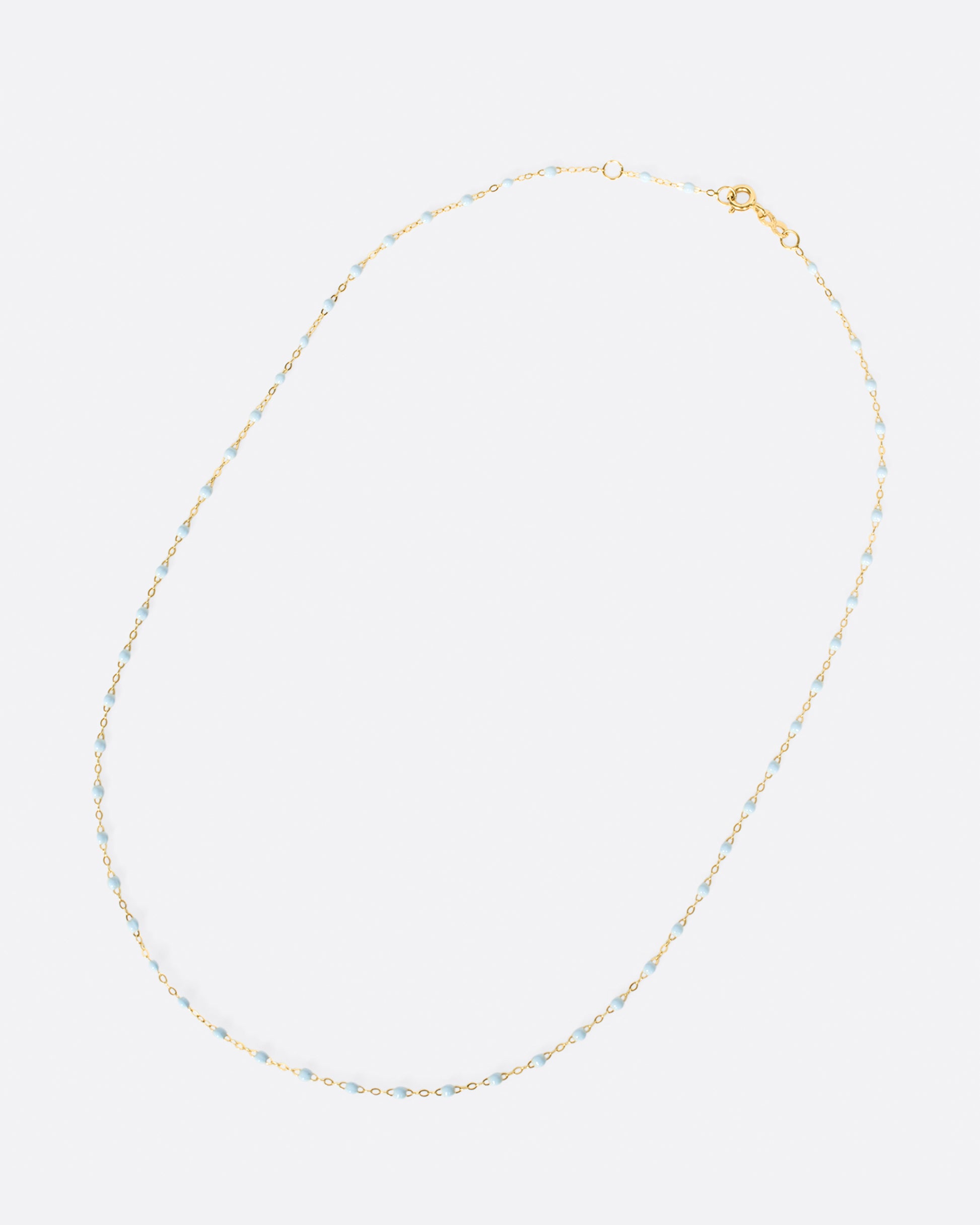 Thin 18k yellow gold chain necklace with resin beads. Each necklace is hand dipped in melted resin to create the beaded effect. 