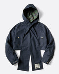 A navy cropped jacket with a detachable hooded scarf, shown from the front.