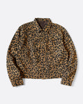 A leopard print leopard jacket in heathered wool with a silky lining. It has a snap button front and a cinch-able back. Shown from the front. 