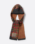 A red tartan wool cap with elongated sides, shown from the front.