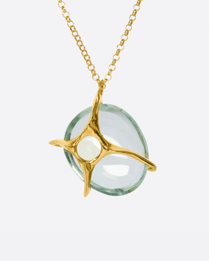Yellow gold and green quartz necklace, back of the pendant showing the gold branches crossing behind the stone