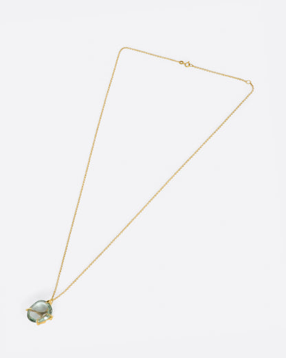Yellow gold and green quartz necklace laid flat, showing the chain length and clasp