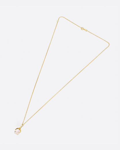 Yellow gold and pink tourmaline pendant necklace laid flat, showing the chain length and clasp
