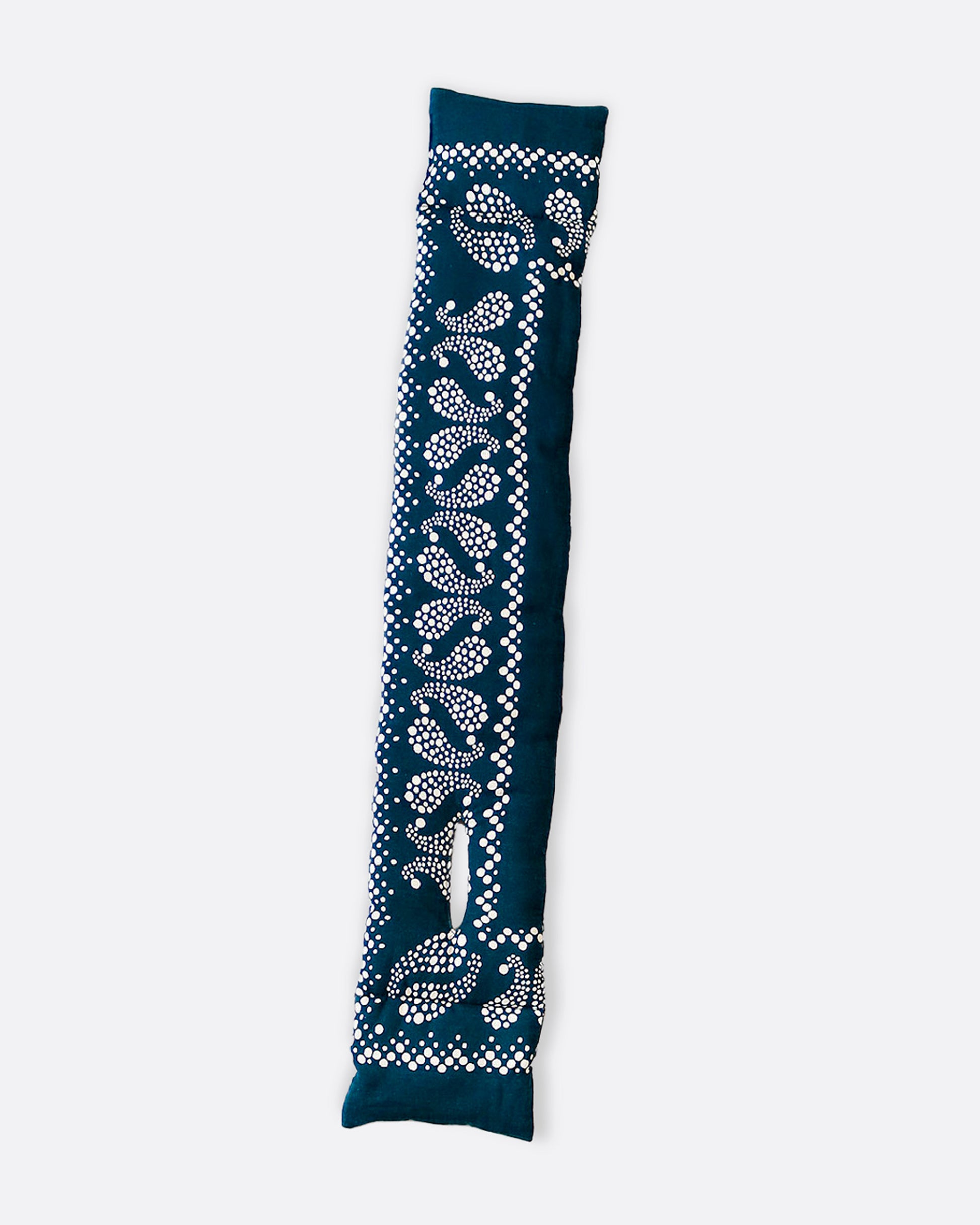 An insulated blue and white paisley printed bandana scarf with an opening at one end, shown open lying flat.